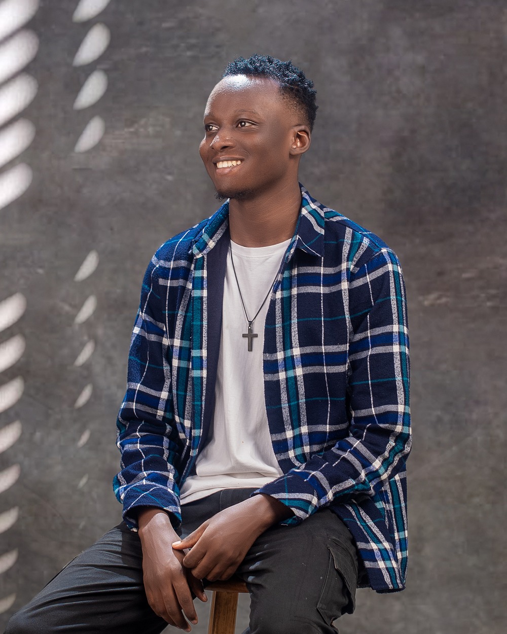 Tolani Jesse smiling in a blue shirt